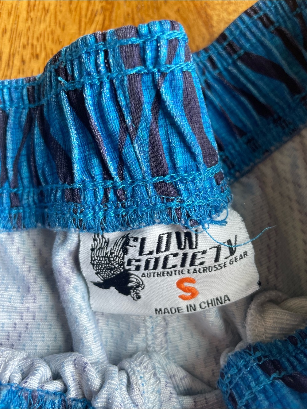 Men's Blue Wave Athletic Lacrosse Shorts with Orange Gradient Sides - Picture 4 of 6